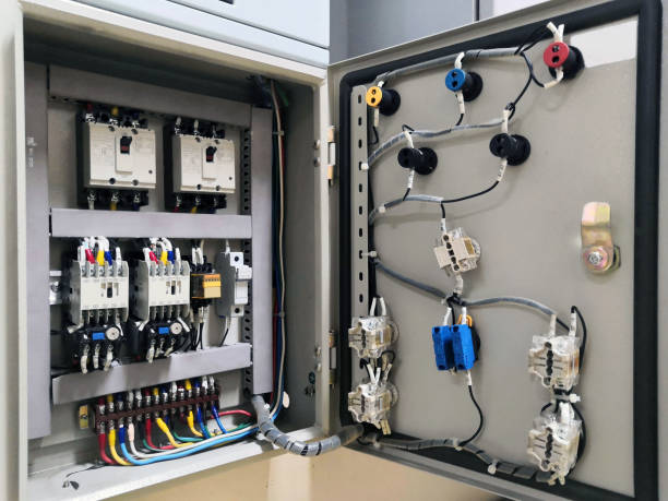 Electrical connector in power lines. Industrial electric enclosure, switch control panel board.Electrical panel at a assembly line factory. Controls and switches.