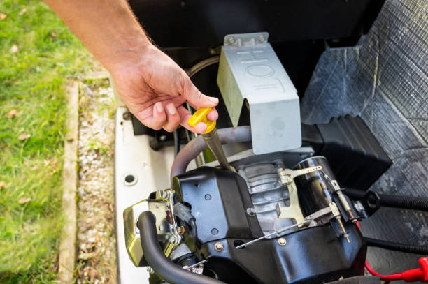 Maintenance Mechanic Inspecting the generator, checking oil level