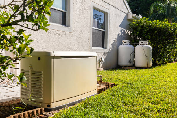generator and propane tanks in the side yard of a Florida home provide backup emergency electricity during power outage.