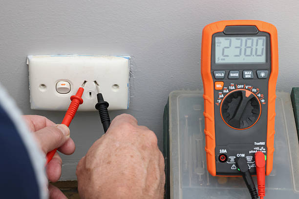 Electrician check plug voltage, multi-meter, Australia. Electrical home, household safety, compliance, standards, regulations, law, regulatory requirements, Electrical Equipment Safety System (EESS)