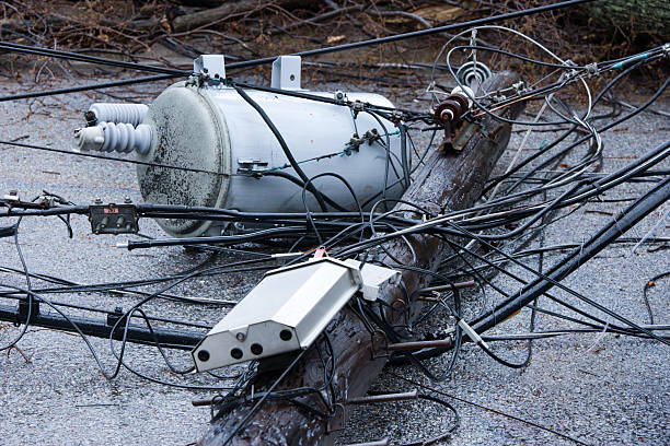 Tree falls after Nor-easter storm and takes down a telephone pole with Transformer.