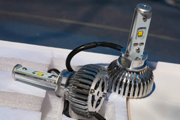 Light bulbs for car lamps. Automotive part in Silvery metallic and black color with wires and connecting elements