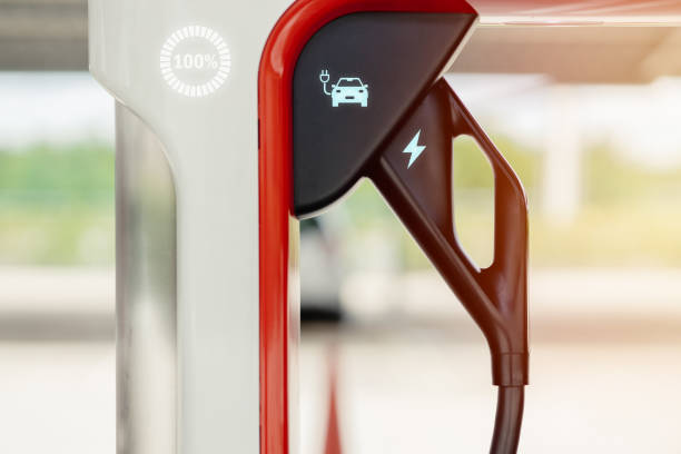 EV car battery charging dock station at parking area, new technology for vehicle with green energy eco power and zero emission.